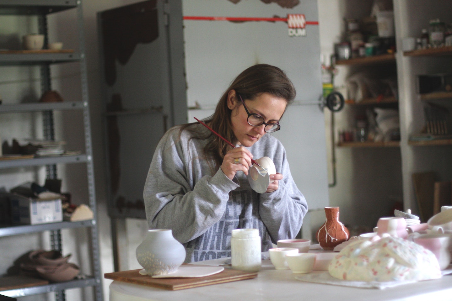 Anastasia, a VAWAA artist, teaches guests how to make different types of ceramic-ware in Spain.