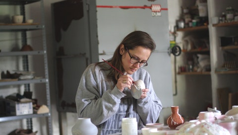 Anastasia, a VAWAA artist, teaches guests how to make different types of ceramic-ware in Spain.