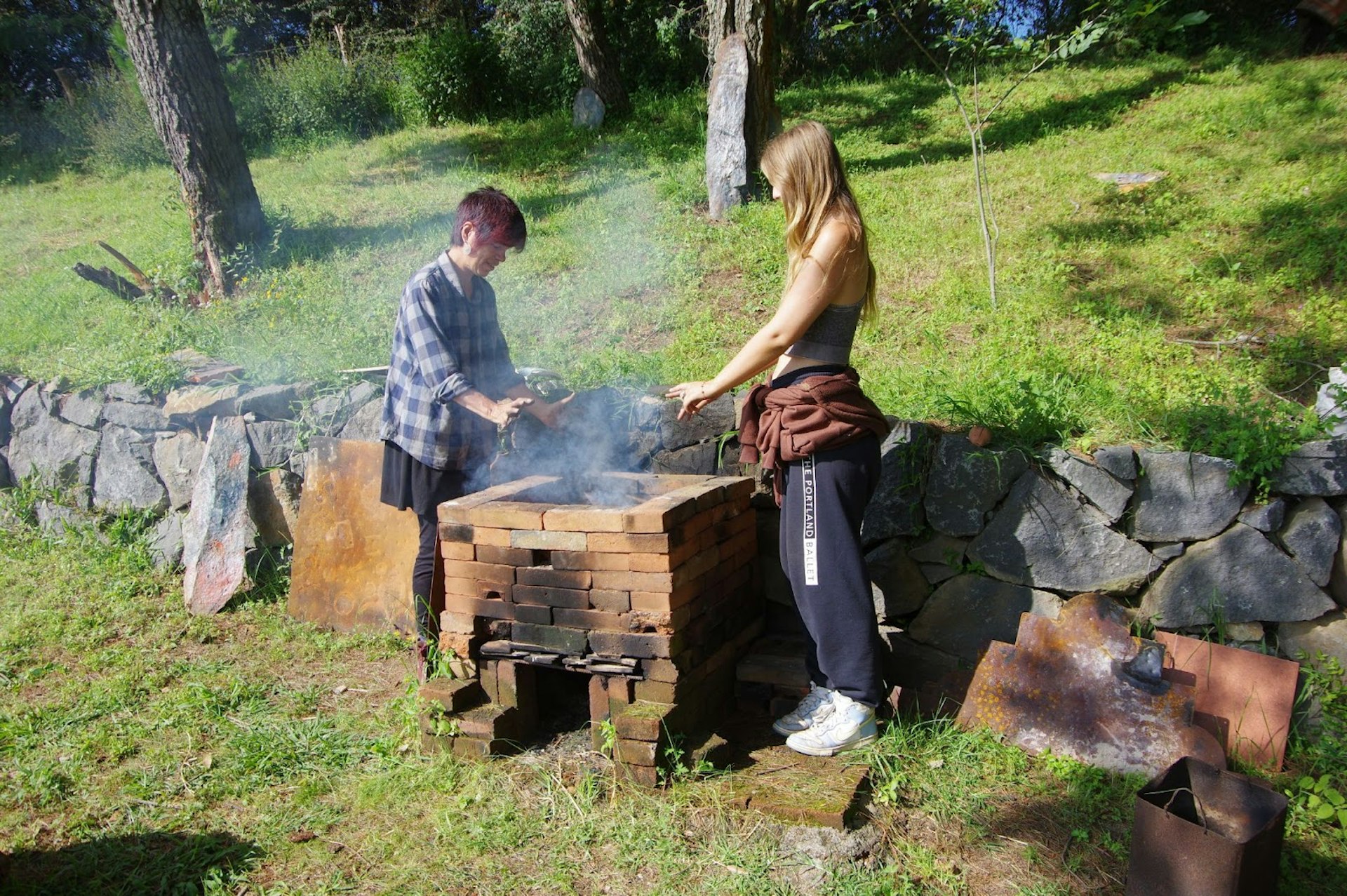 A young apprentice using a kiln