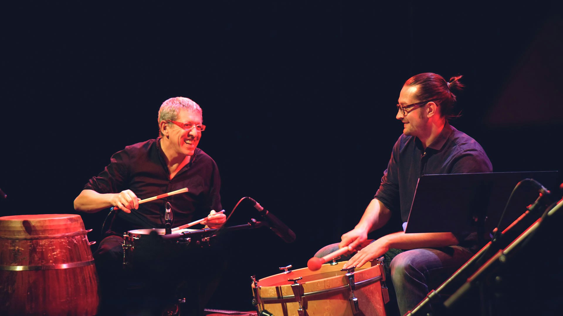 Performing with fellow drummer