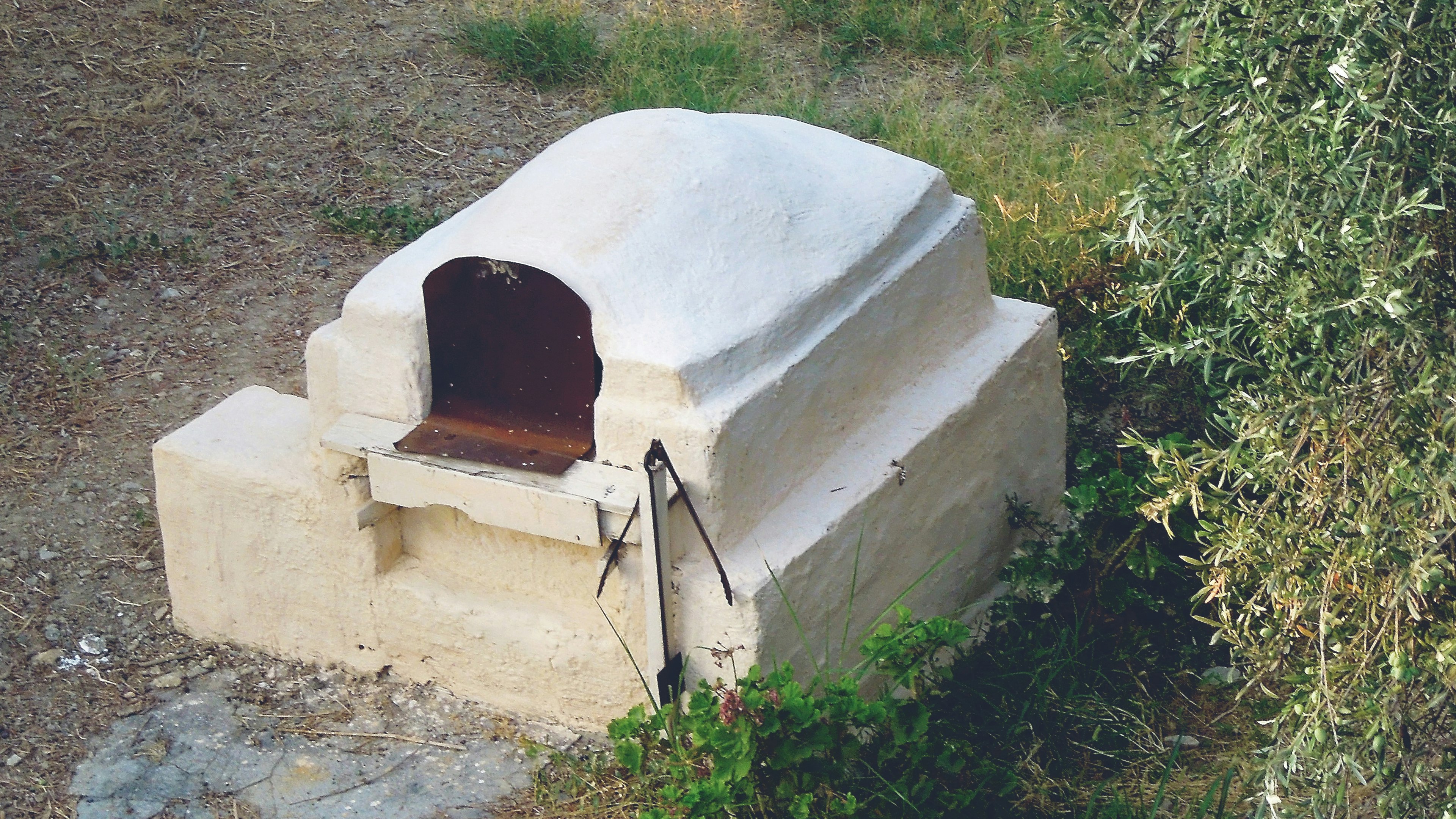 Cooking with a Greek stone oven.