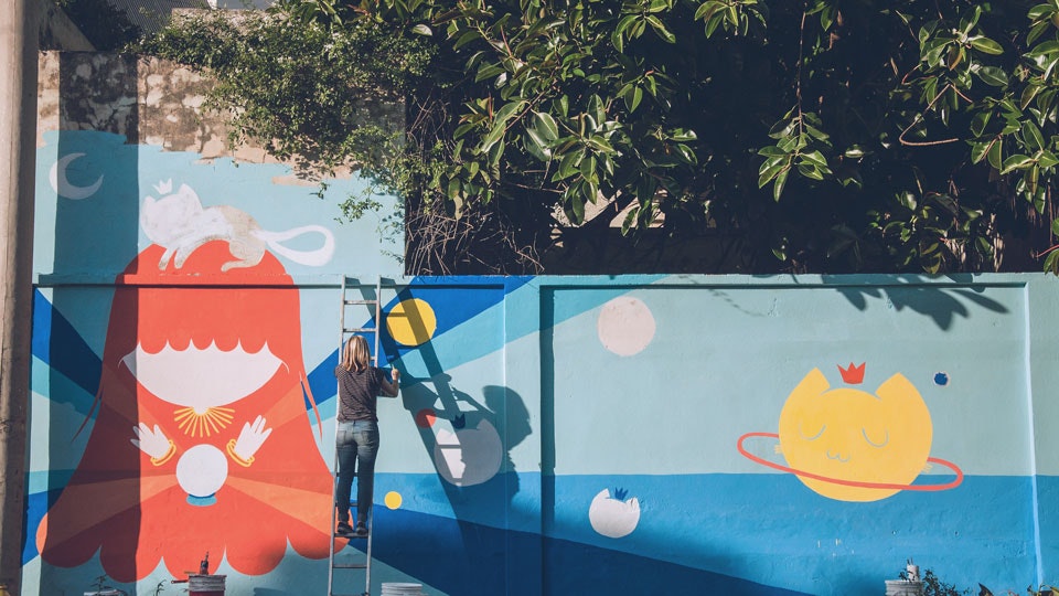 Street artist at work: Pum Pum working on a space themed wall mural in Buenos Aires via Vacation with an Artist  #creativevacations #vawaa #streetart #urbanart #buenosaires #slowtravel #wallmurals #creativity #argentina