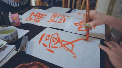 Practice brush techniques and line movements in calligraphy.