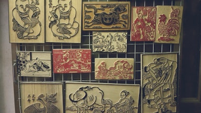 Explore wood stamp art.