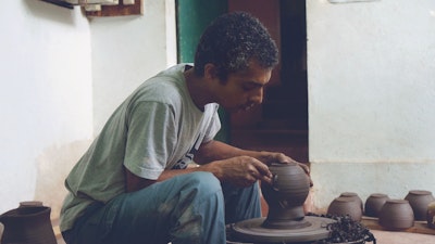 Learn from an artist how to create beautiful ceramic art using wheel turning traditional techniques and clay in Goa, India. #creativevacation #vawaa #discovergoa #claypottery #india #ceramicsidea #claycrafts #ceramicart #travelasia #art #creativity