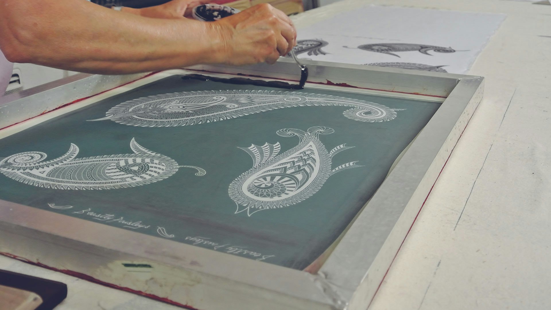 Learning the process of textile screen printing.