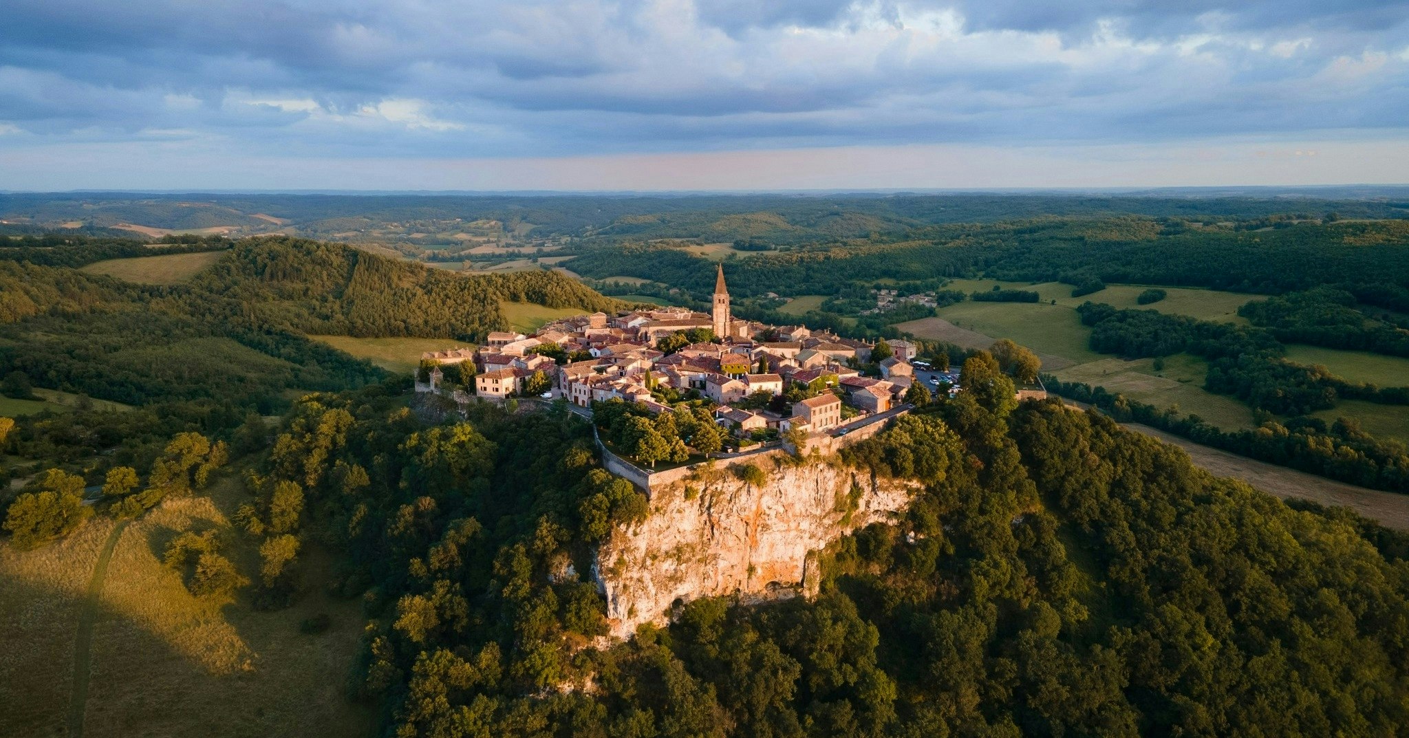In Fayssac, France, medieval charm and centuries of copperworking heritage atop rolling hills.