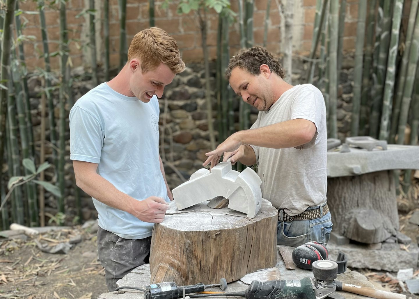VAWAA guest William learning stone sculpting with master artist Julio Martínez in Mexico.